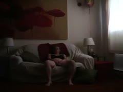 Sexy natural thick redhead sits on the ottoman and masturbates 